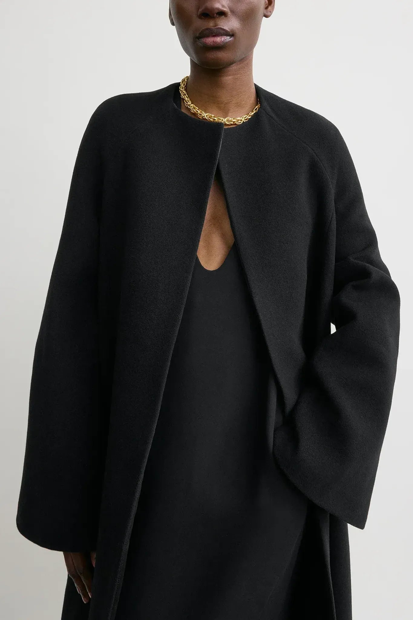 Bell-sleeve coat in black