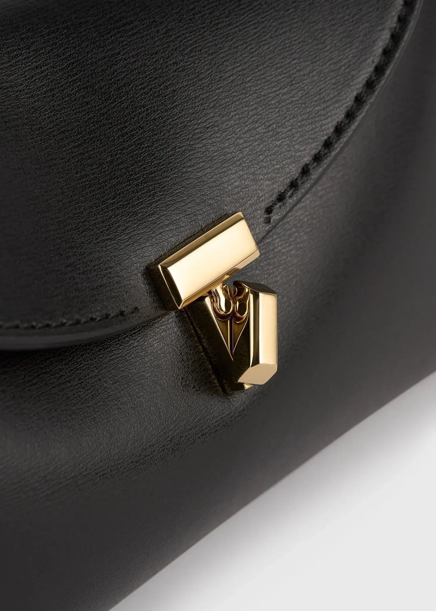 Clutch Mini T-Lock Leather in Black